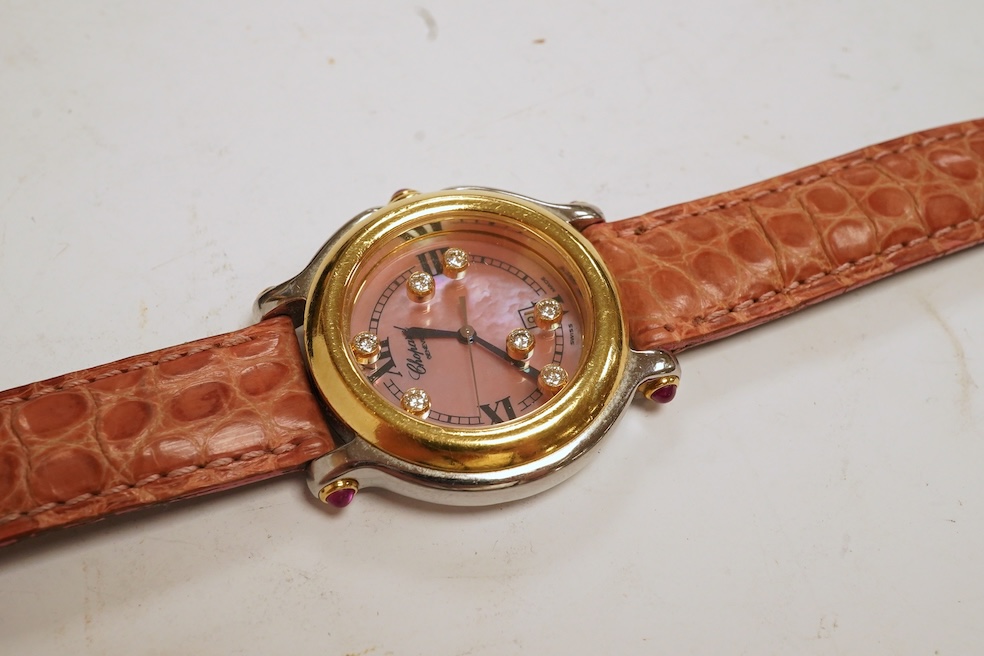 A lady's recent steel and gold Chopard 'Happy Sport' quartz wrist watch, the paua shell dial with seven 'floating' diamonds, on a leather strap wit gold plated Chopard clasp, with box, no papers. Condition - fair